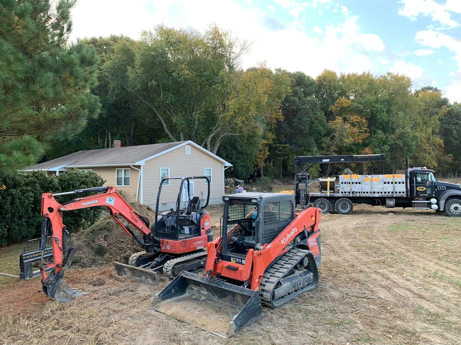 Excavation for a new residential addition by Apex Construction.