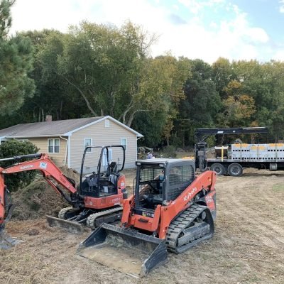 Excavation for a new residential addition by Apex Construction.