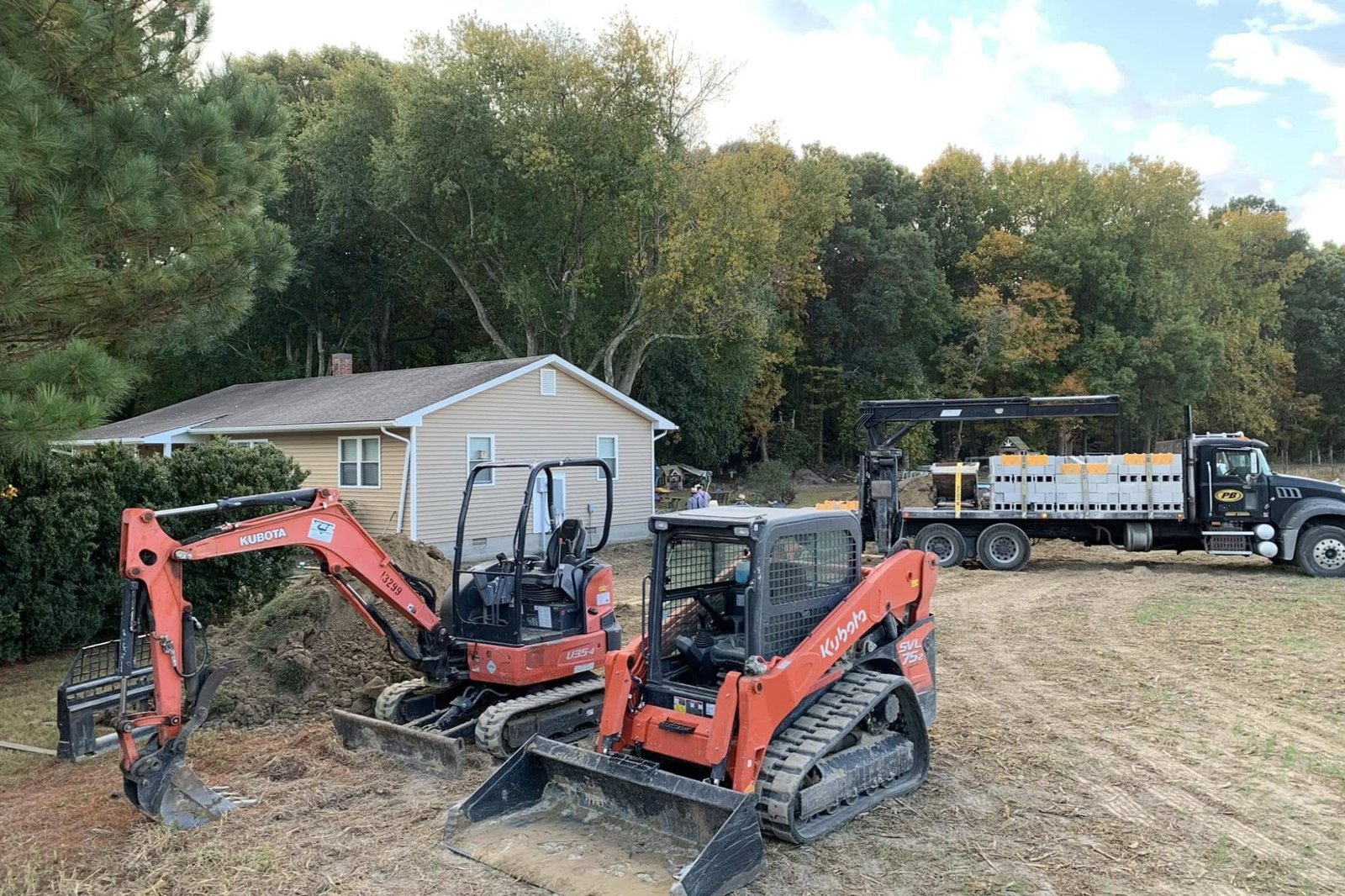 Excavation for a new residential addition by Apex Construction.